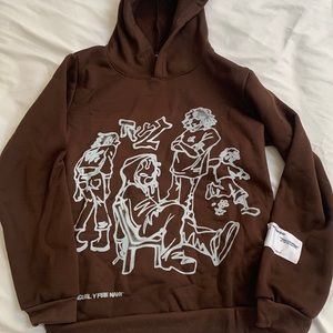 A brown hoodie with graphic design